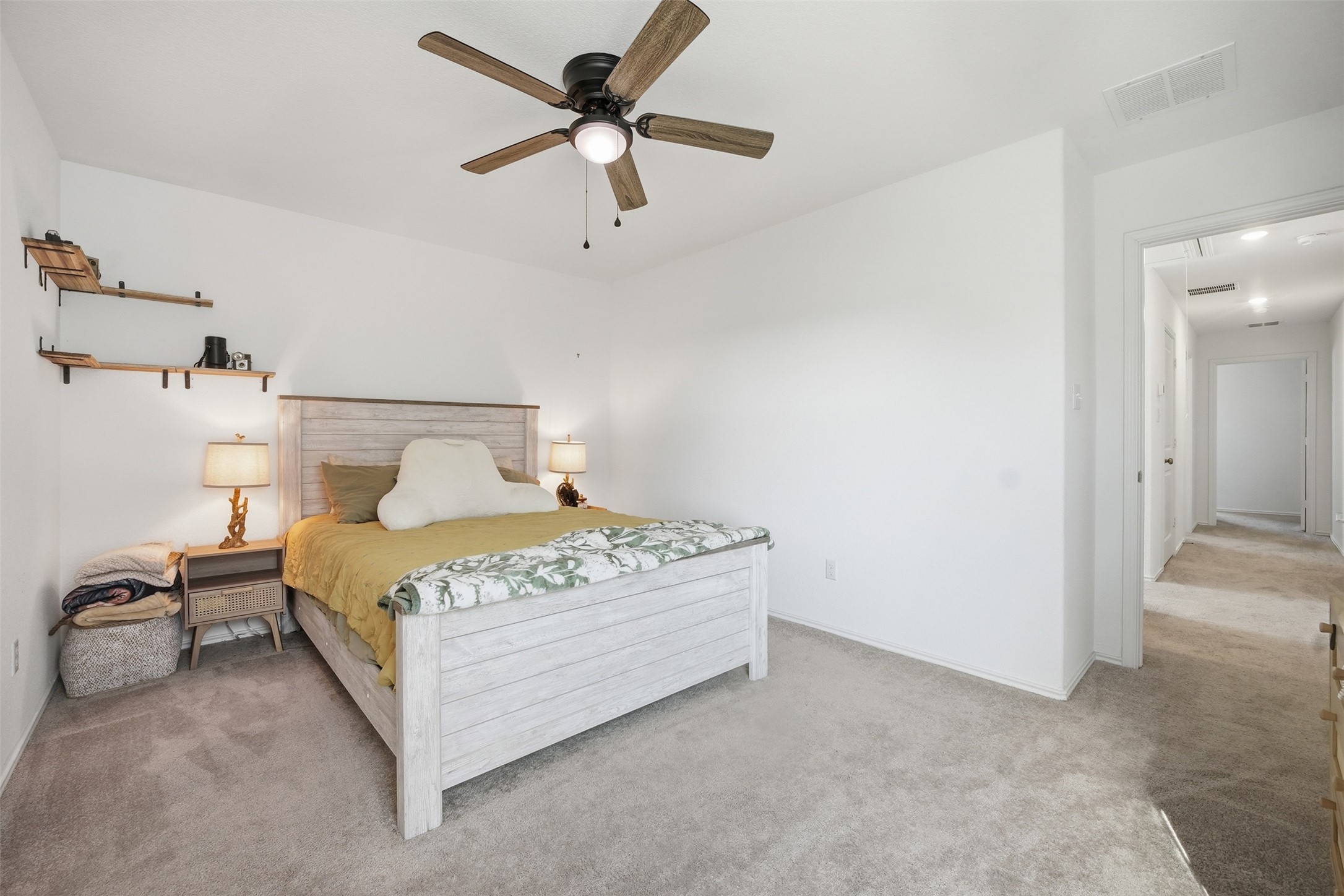 625 Marty Allen Loop Jarrell, TX 76537 - Photo 20 of 25 a bedroom with a bed and a ceiling fan