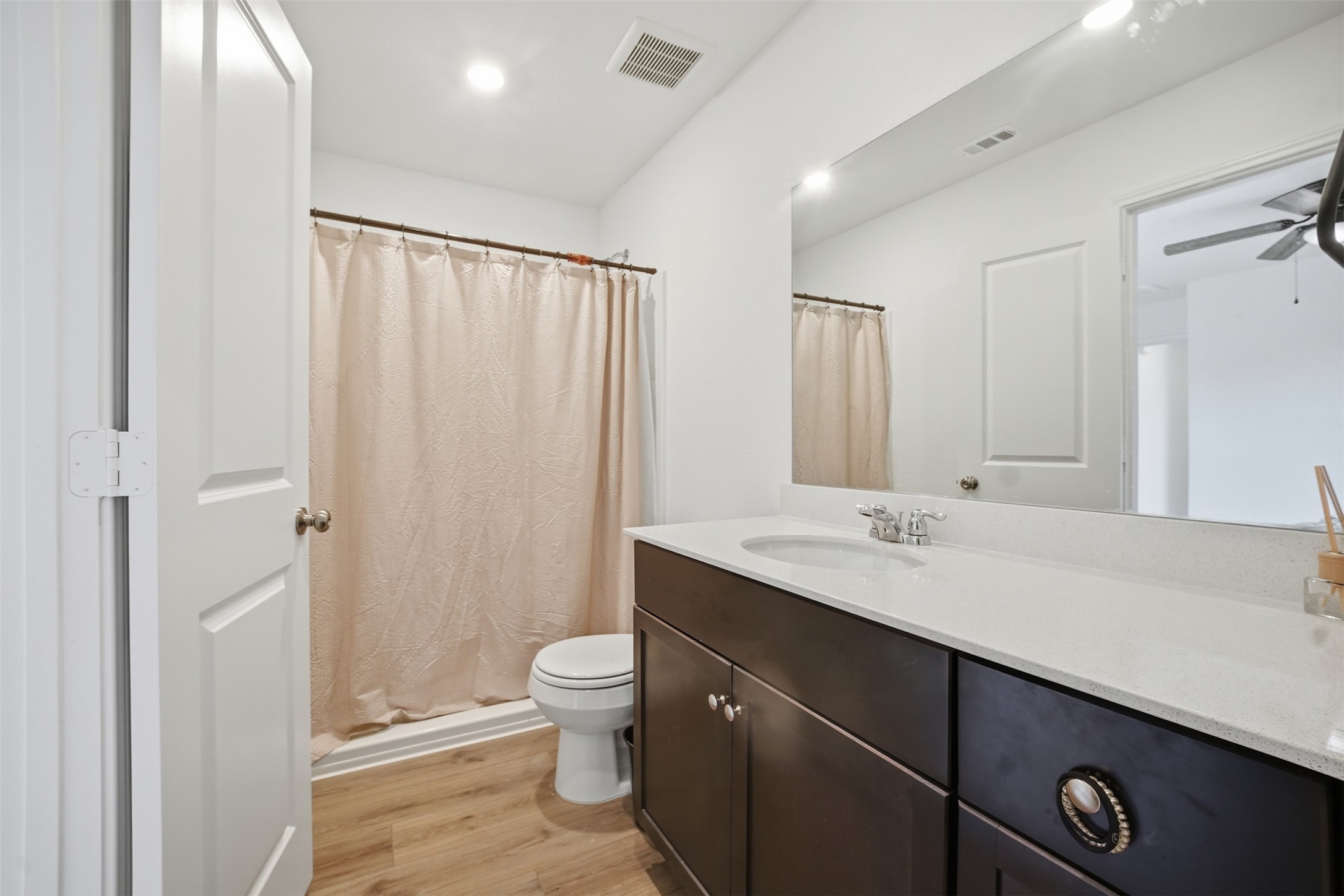 625 Marty Allen Loop Jarrell, TX 76537 - Photo 21 of 25 a bathroom with a granite countertop sink toilet and shower
