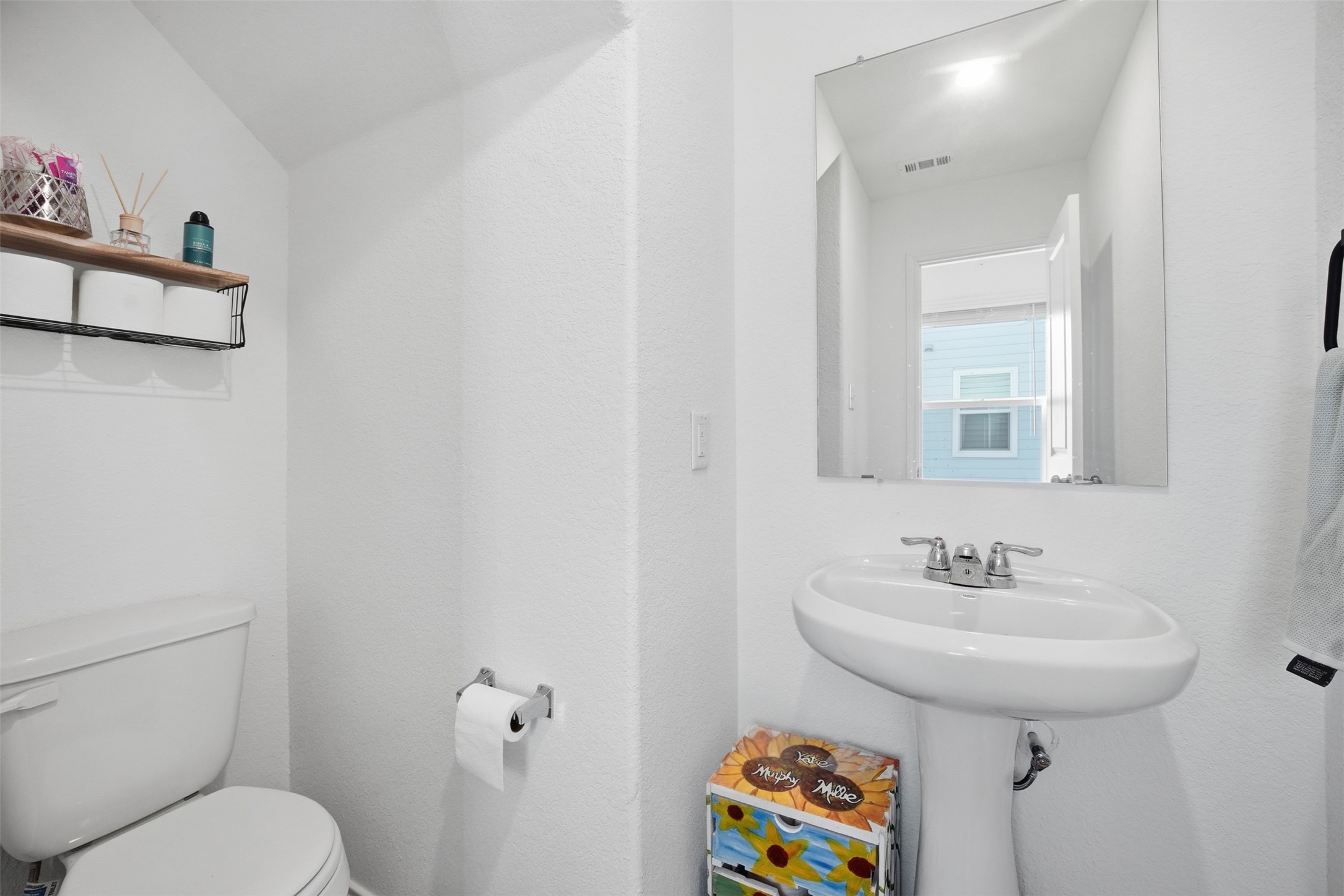 625 Marty Allen Loop Jarrell, TX 76537 - Photo 6 of 25 a bathroom with a sink a toilet and a mirror