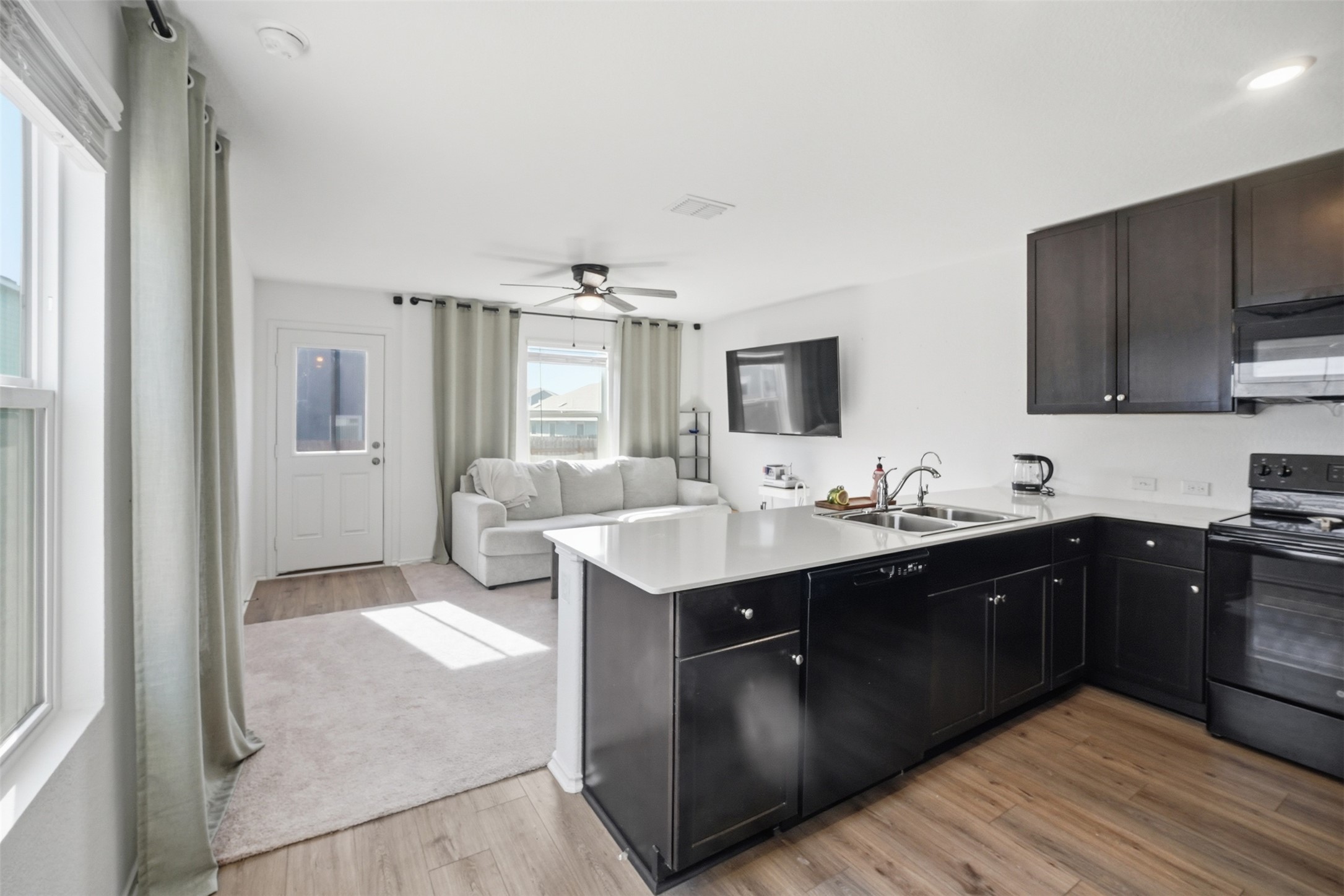 625 Marty Allen Loop Jarrell, TX 76537 - Photo 7 of 25 a kitchen with a sink and cabinets
