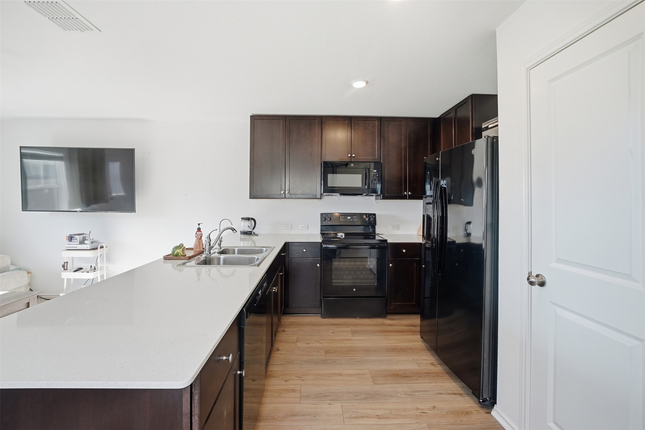 625 Marty Allen Loop Jarrell, TX 76537 - Photo 8 of 25 a kitchen with a refrigerator stove and sink