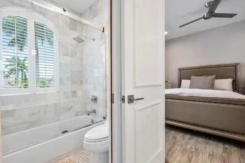 a bathroom with a toilet and a bathtub