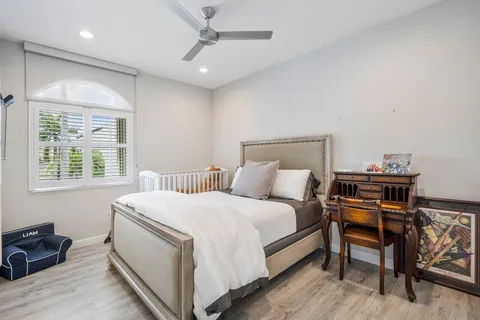 a picture of a room with lots of white cabinets