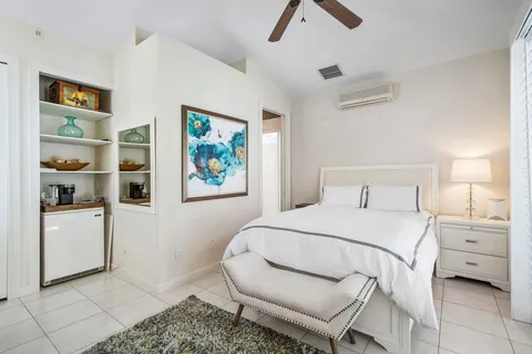 a bedroom with a bed and a table in it