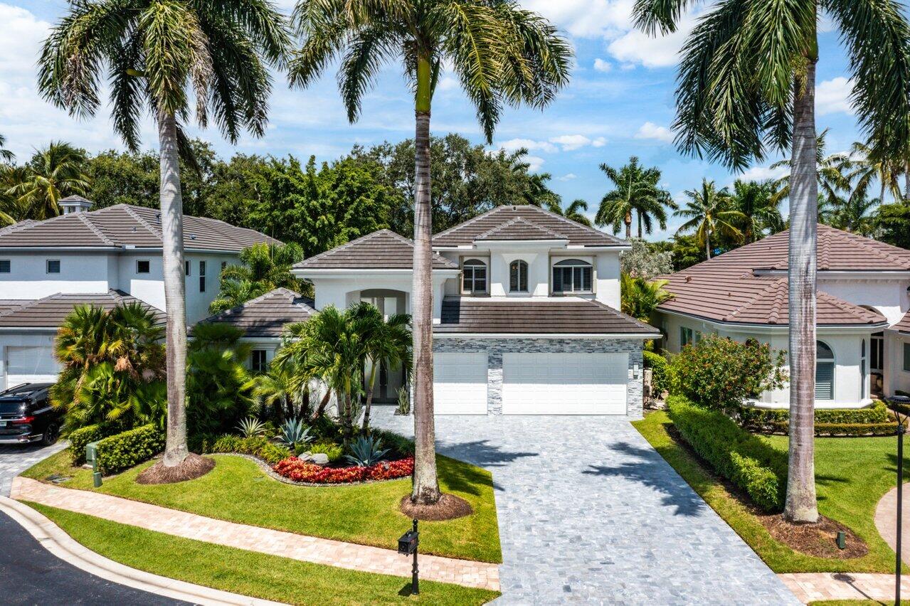 6379 Avalon Pointe Court Boca Raton, FL 33496 - Photo 23 of 37 a front view of a house with garden