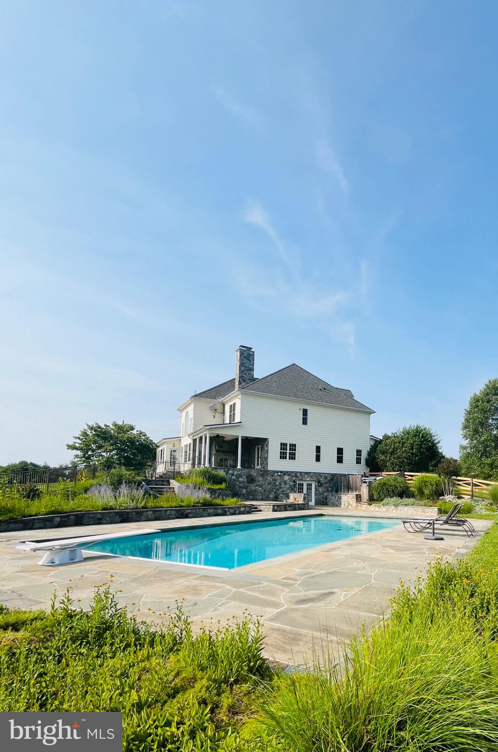 19014 Beallsville Road Poolesville, MD 20837 - Photo 2 of 6 Serene retreat with a sparkling pool.