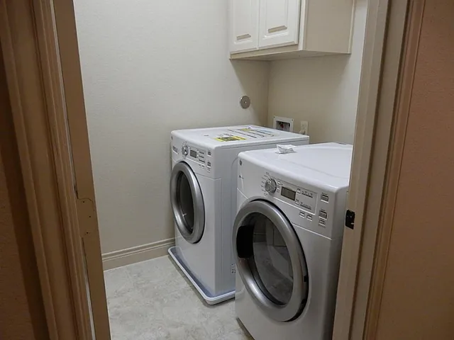 a utility room with dryer and washer