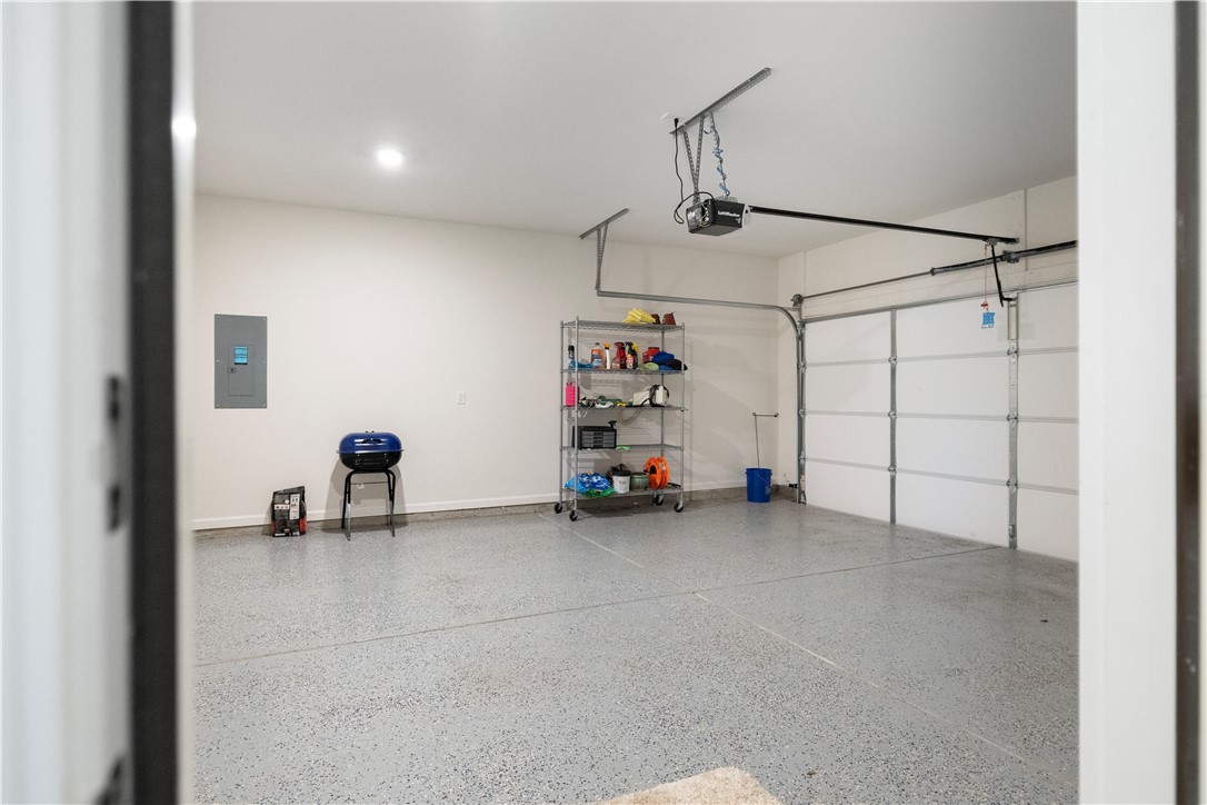 104 Village Main Anderson, SC 29621 - Photo 26 of 32 This spacious garage features durable flooring and an automatic door for convenient vehicle access and storage.