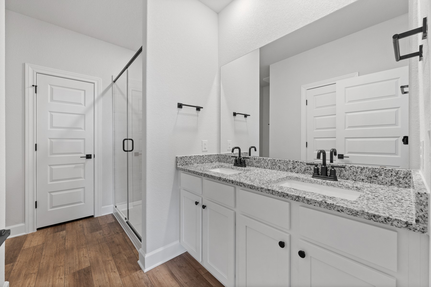 9709 Gladsome Path Manor Manor, TX 78653 - Photo 7 of 15 a bathroom with a granite countertop sink and a mirror