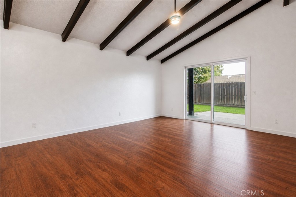 1908 Chelwood Way Modesto, CA 95355 - Photo 16 of 54 a view of an empty room with wooden floor and a window