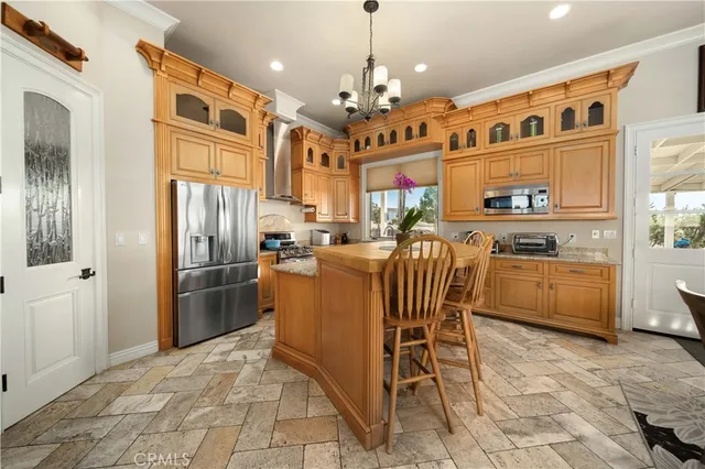 a dining room with furniture a rug and a large window