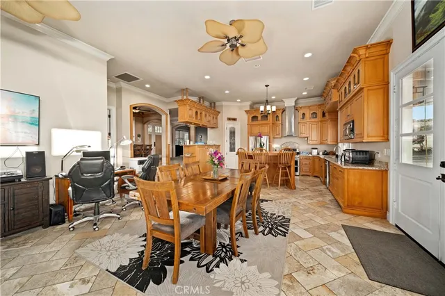 a bathroom with a granite countertop sink and a large mirror