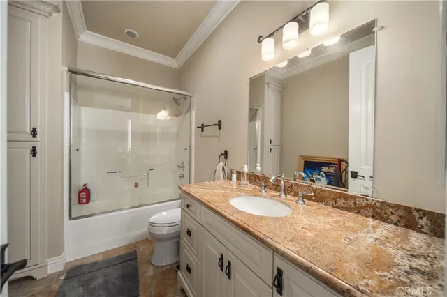 a utility room with sink dryer and washer