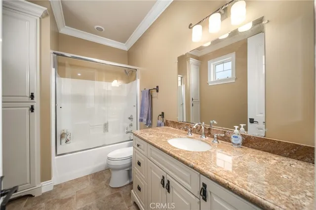 a living room with furniture and a clock