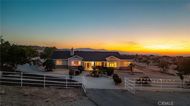 a view of a patio with swimming pool and outdoor seating