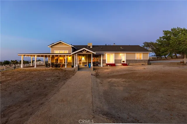 a front view of house with a yard