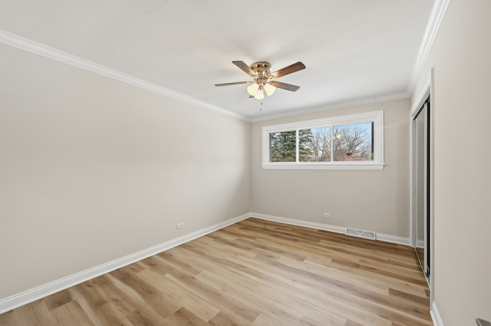 703 West Man A Wa Trail Mount Mount Prospect, IL 60056 - Photo 17 of 35 a view of empty room with wooden floor