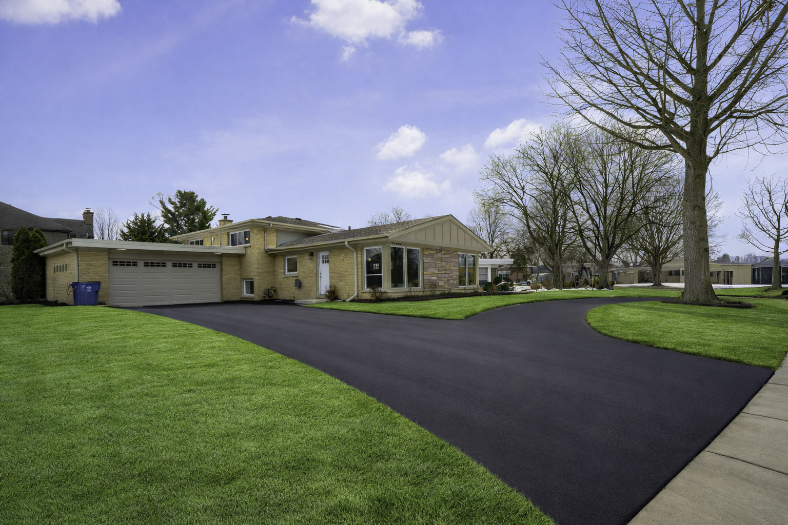 703 West Man A Wa Trail Mount Mount Prospect, IL 60056 - Photo 2 of 35 a front view of house with yard and green space