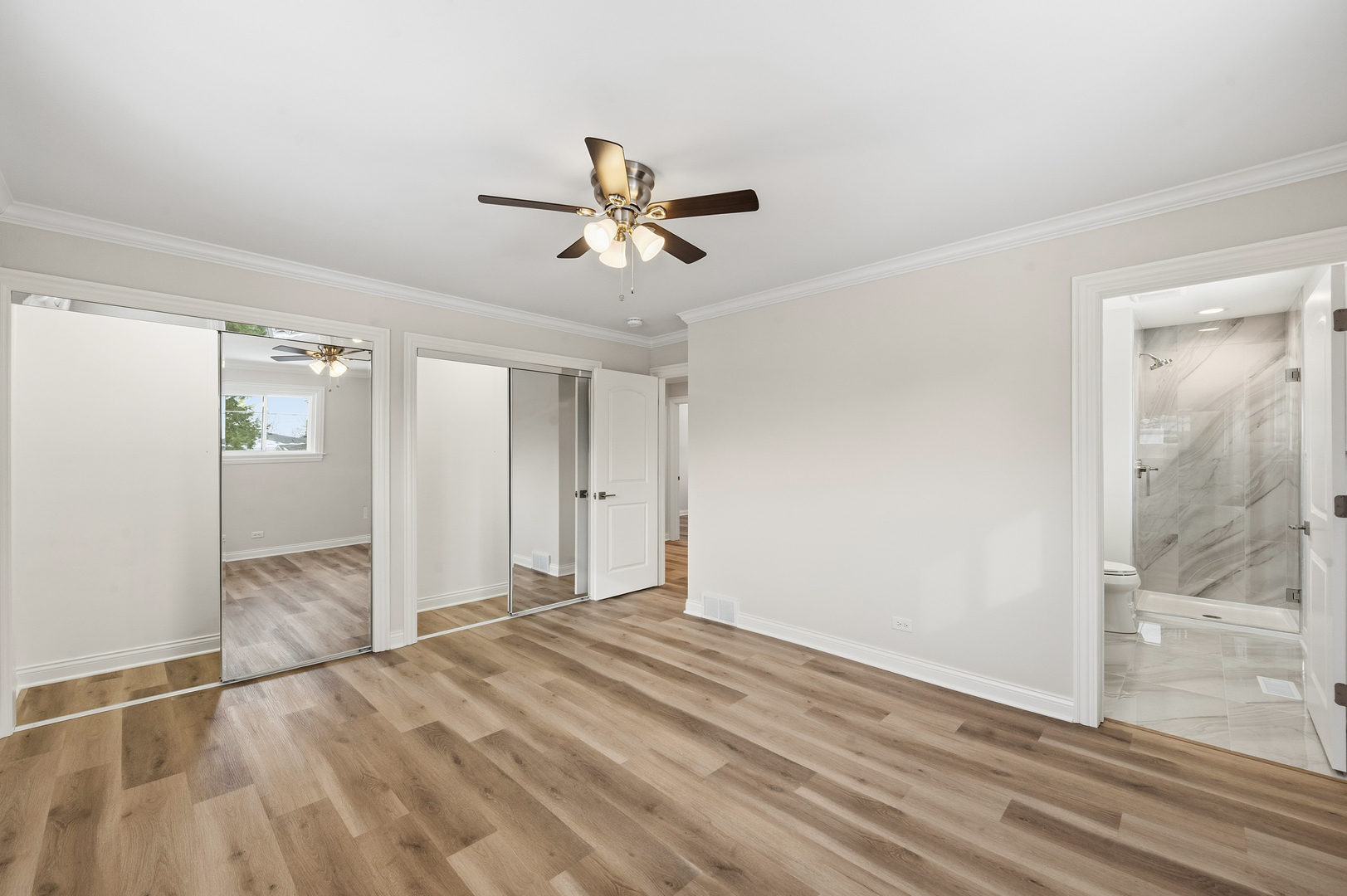 703 West Man A Wa Trail Mount Mount Prospect, IL 60056 - Photo 21 of 35 a view of empty room with wooden floor and fan