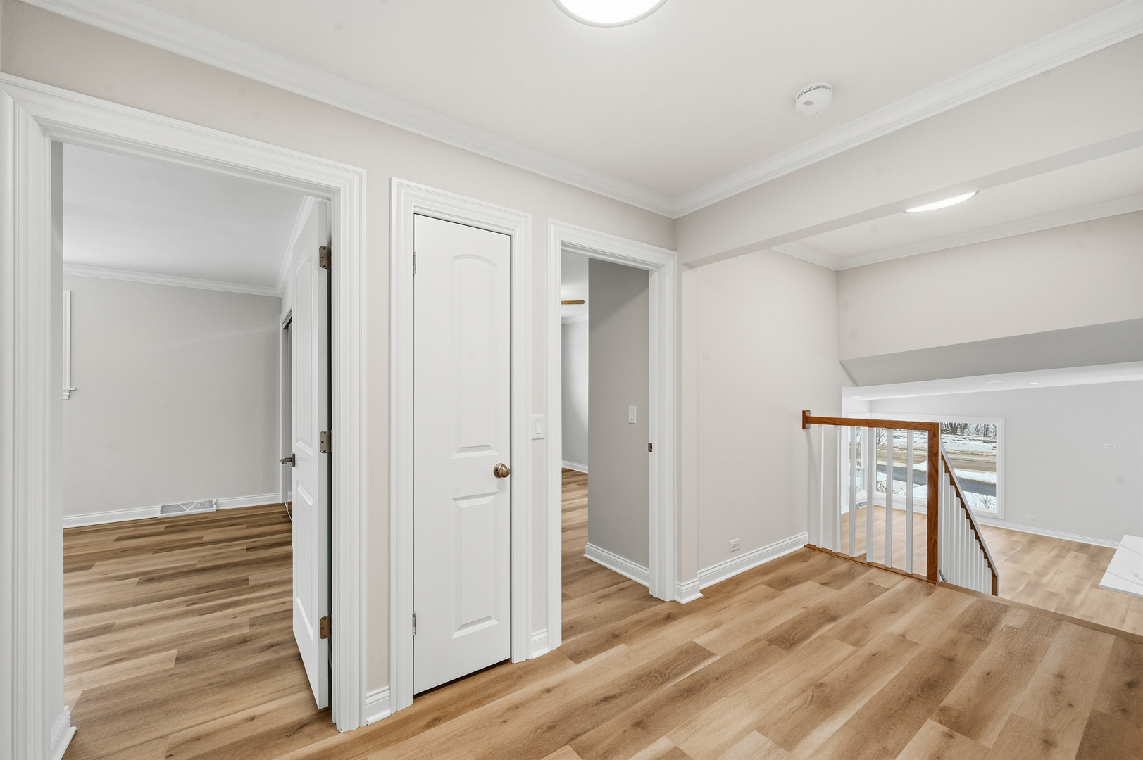 703 West Man A Wa Trail Mount Mount Prospect, IL 60056 - Photo 23 of 35 a view of empty room with wooden floor