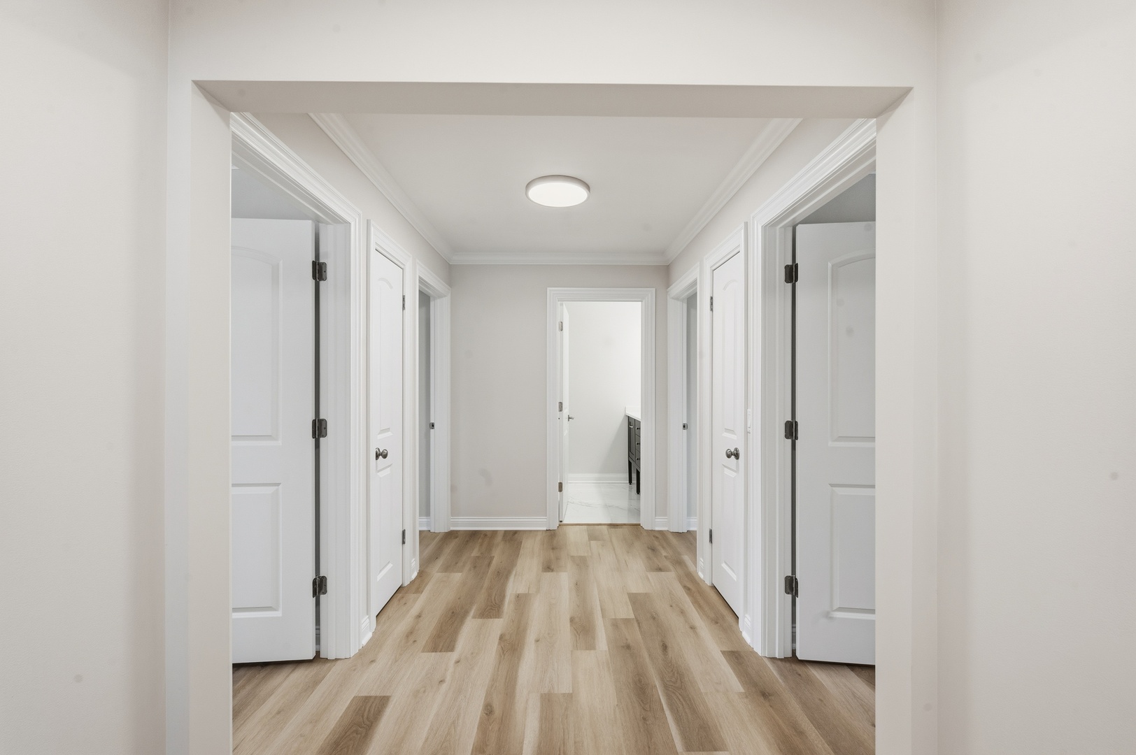703 West Man A Wa Trail Mount Mount Prospect, IL 60056 - Photo 24 of 35 a view of a hallway with wooden floor and a bathroom