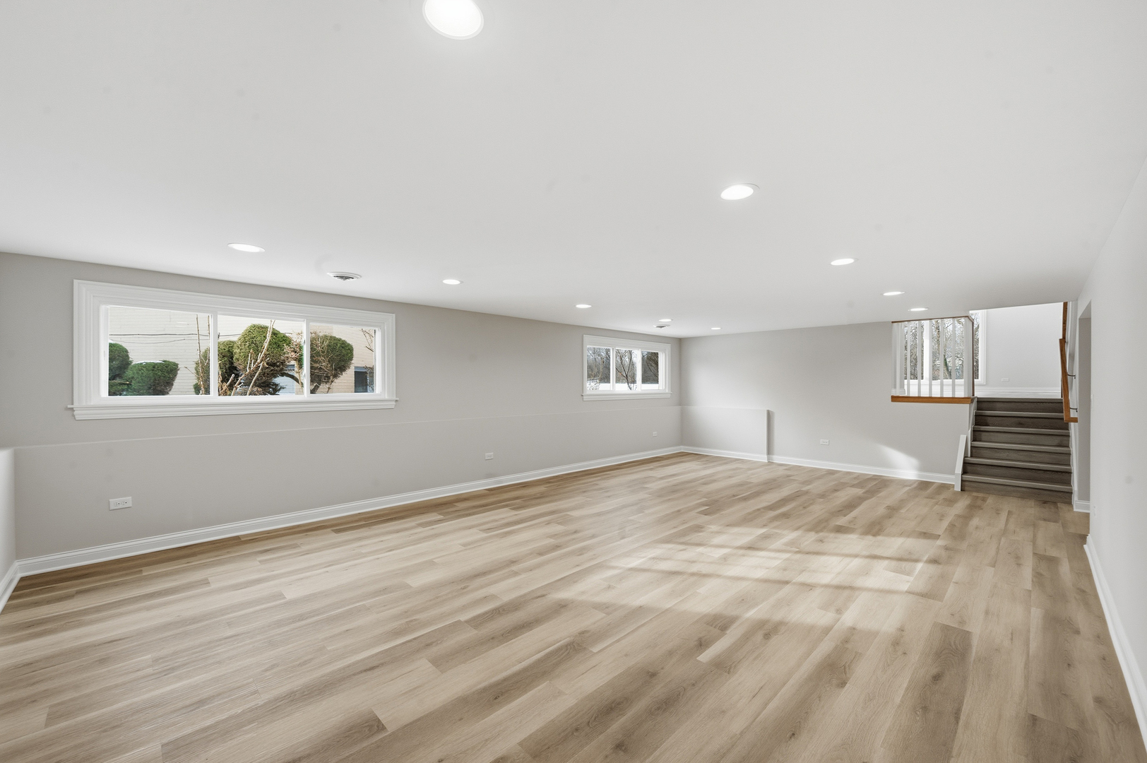 703 West Man A Wa Trail Mount Mount Prospect, IL 60056 - Photo 27 of 35 a view of an empty room with wooden floor and a window