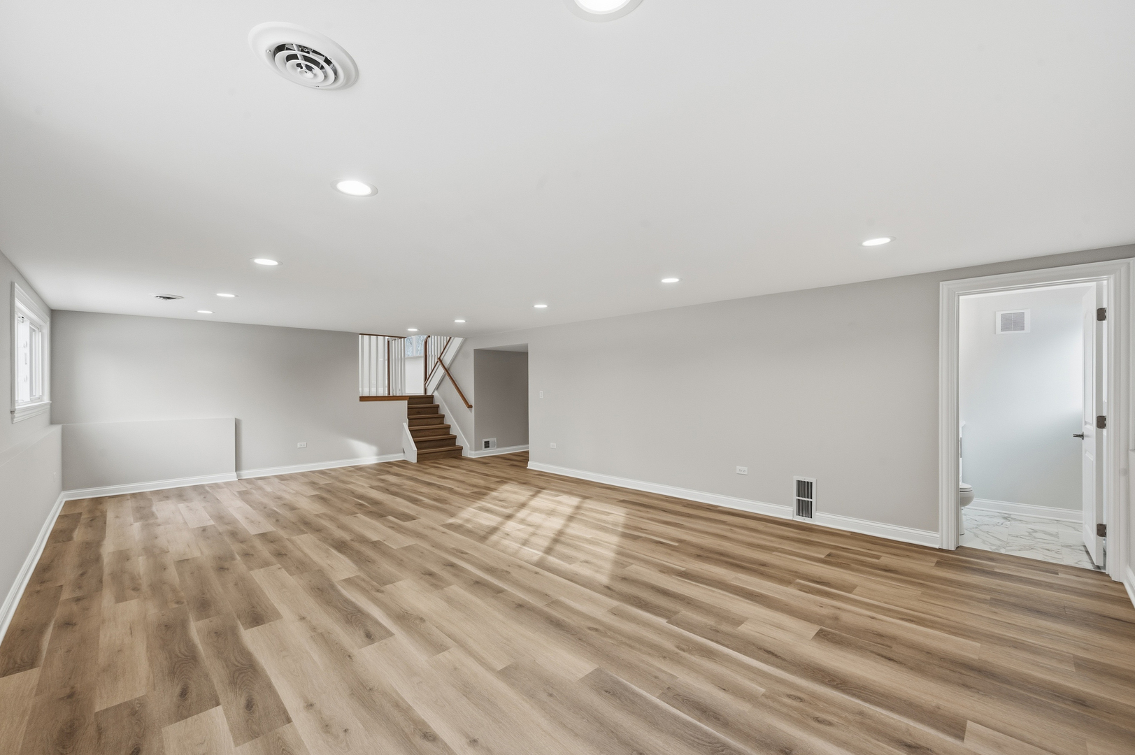 703 West Man A Wa Trail Mount Mount Prospect, IL 60056 - Photo 29 of 35 a view of empty room with wooden floor