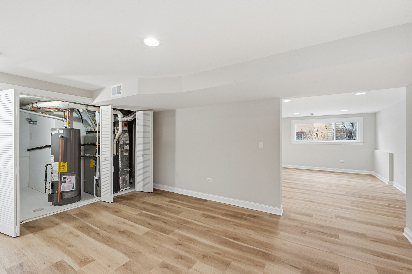 703 West Man A Wa Trail Mount Mount Prospect, IL 60056 - Photo 33 of 35 a view of an empty room with wooden floor and a window