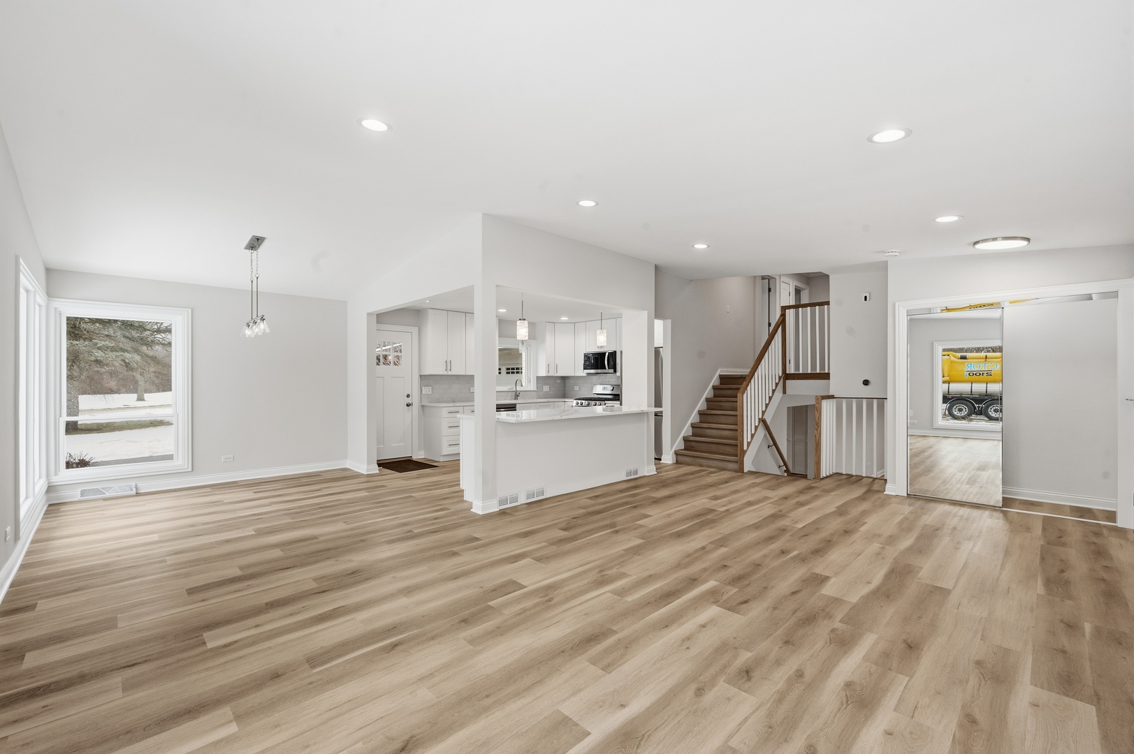 703 West Man A Wa Trail Mount Mount Prospect, IL 60056 - Photo 6 of 35 a view of a kitchen with a sink and a refrigerator