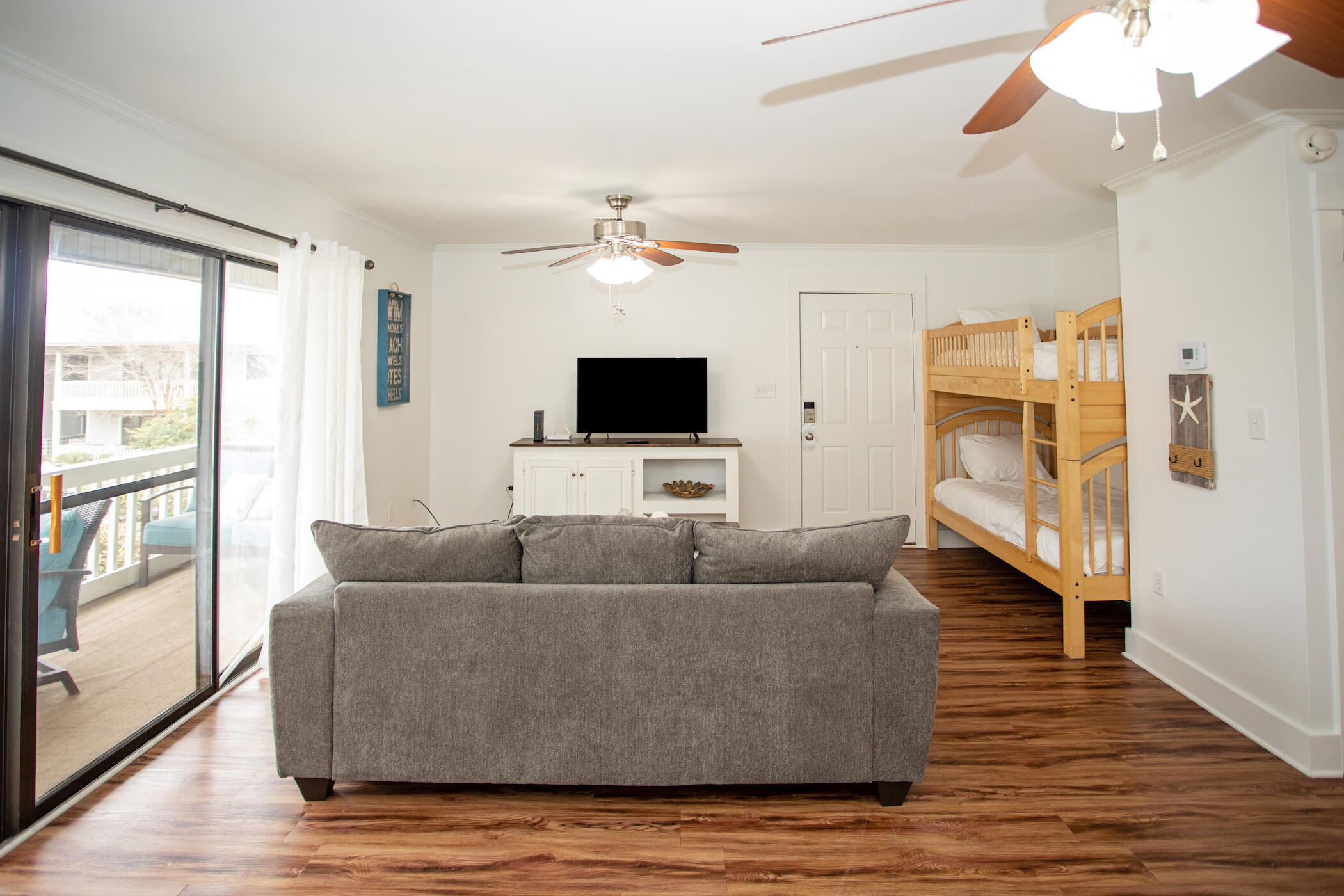 3799 East County Highway 30A, Unit H 2 Santa Rosa Beach, FL 32459 - Photo 13 of 41 a living room with furniture and a flat screen tv