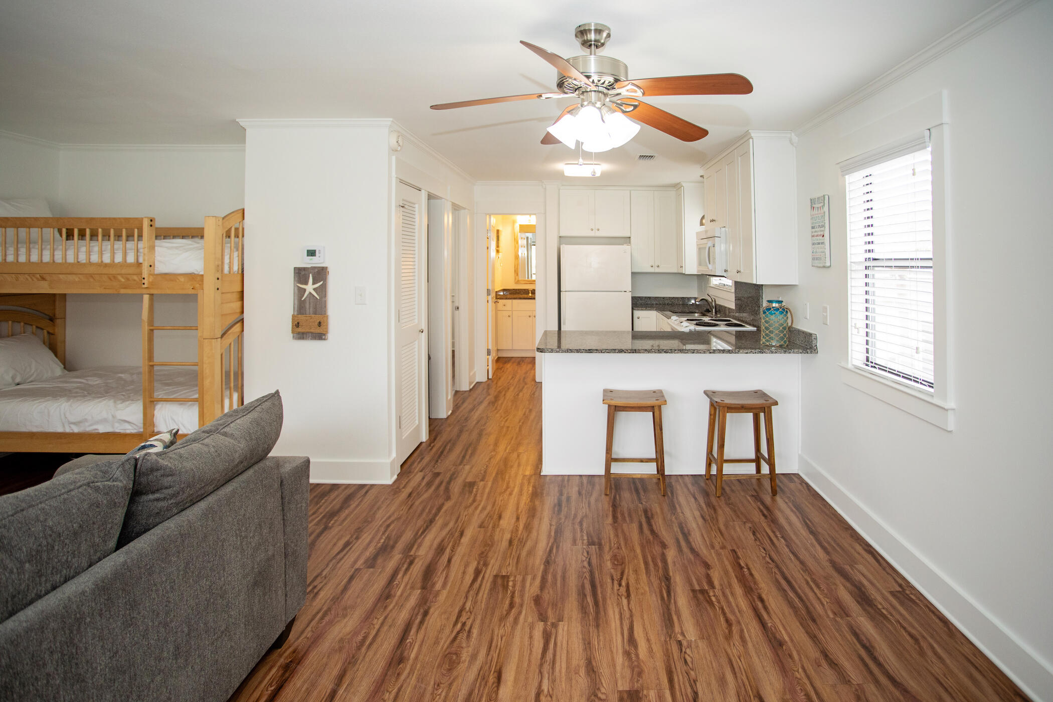 3799 East County Highway 30A, Unit H 2 Santa Rosa Beach, FL 32459 - Photo 14 of 41 a living room with furniture and a wooden floor