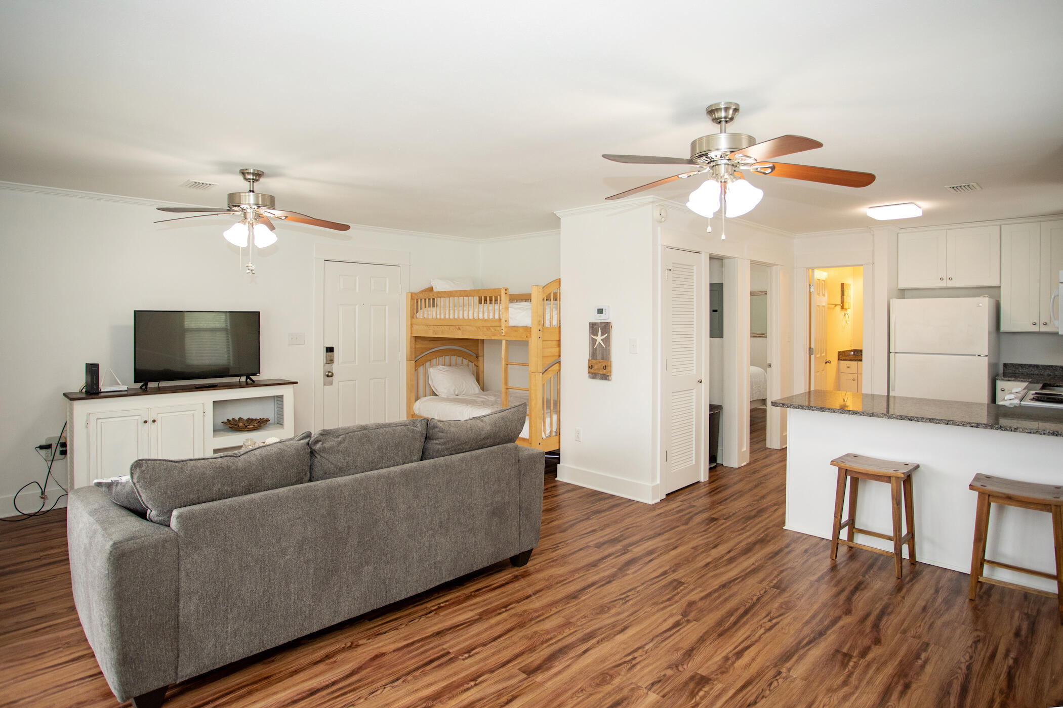 3799 East County Highway 30A, Unit H 2 Santa Rosa Beach, FL 32459 - Photo 15 of 41 a living room with furniture and a flat screen tv