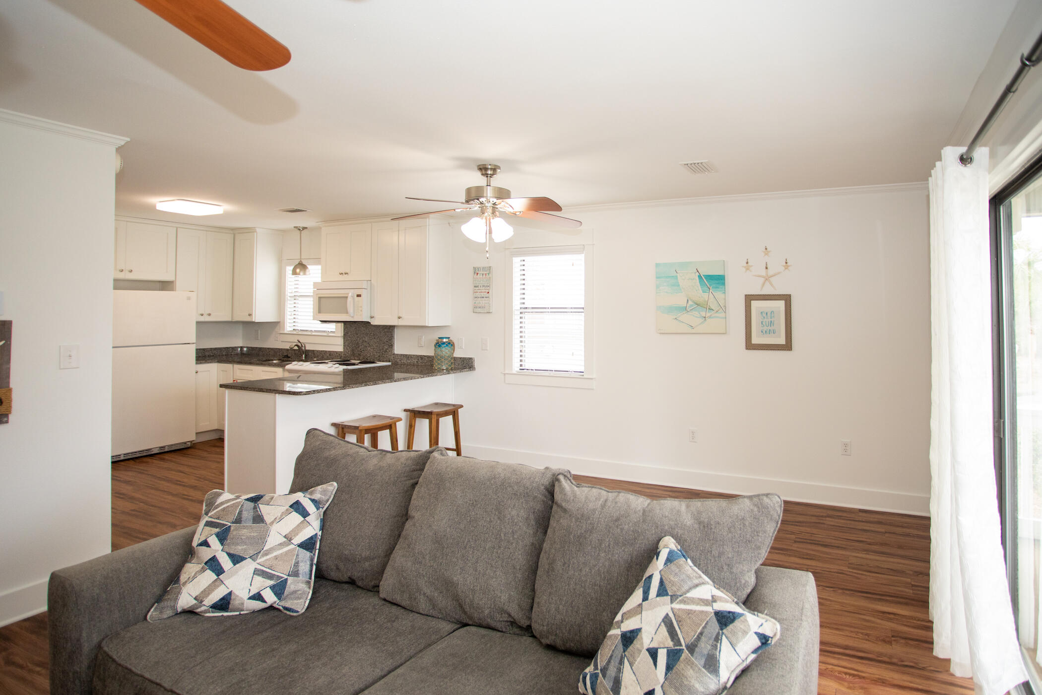 3799 East County Highway 30A, Unit H 2 Santa Rosa Beach, FL 32459 - Photo 16 of 41 a living room with furniture kitchen and a window