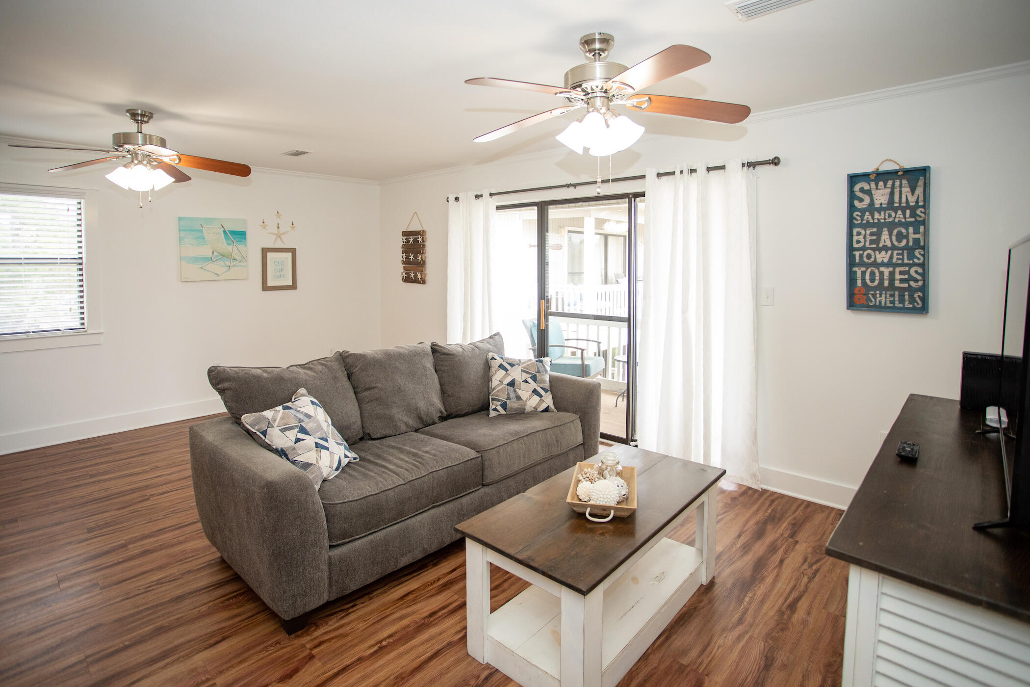 3799 East County Highway 30A, Unit H 2 Santa Rosa Beach, FL 32459 - Photo 18 of 41 a living room with furniture and a wooden floor