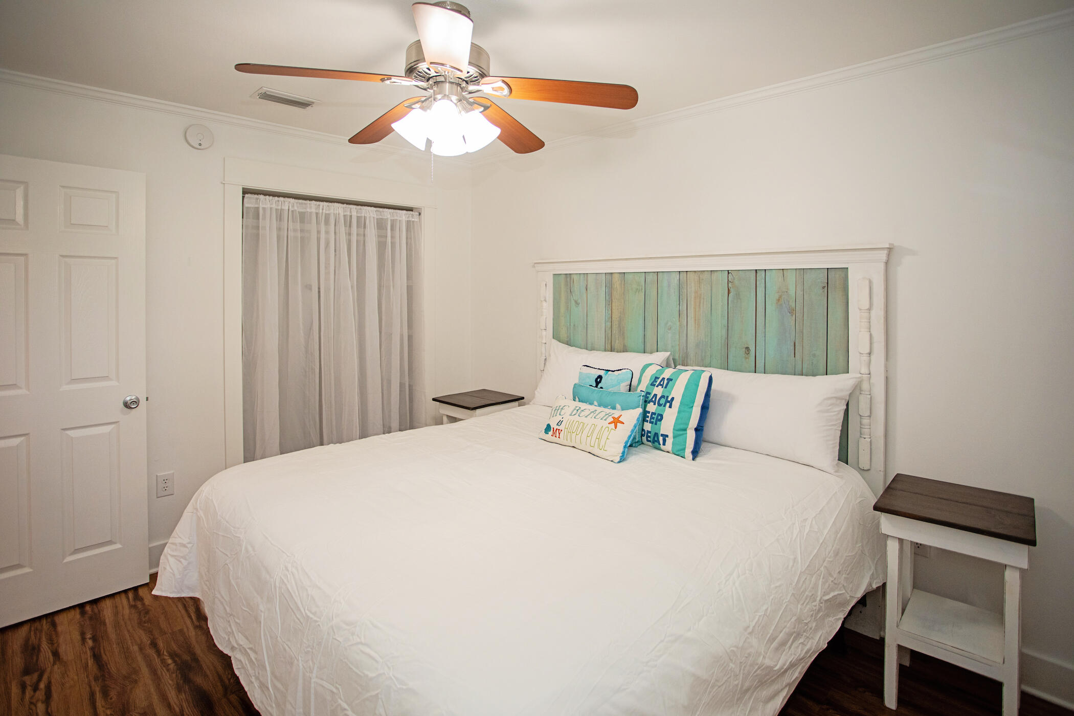 3799 East County Highway 30A, Unit H 2 Santa Rosa Beach, FL 32459 - Photo 20 of 41 a bed sitting in a bedroom next to a window and a chandelier