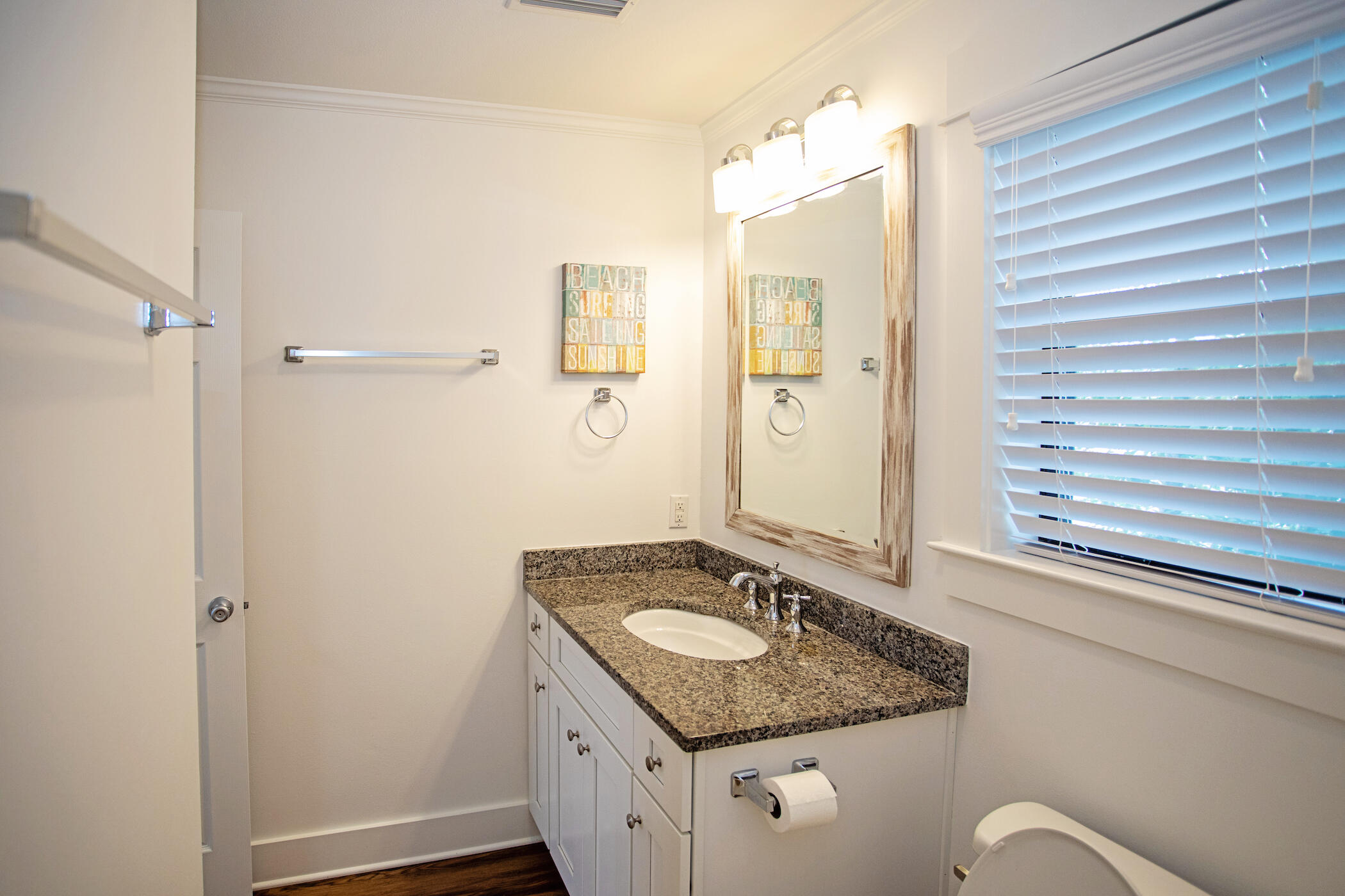 3799 East County Highway 30A, Unit H 2 Santa Rosa Beach, FL 32459 - Photo 22 of 41 a bathroom with a granite countertop sink and a mirror
