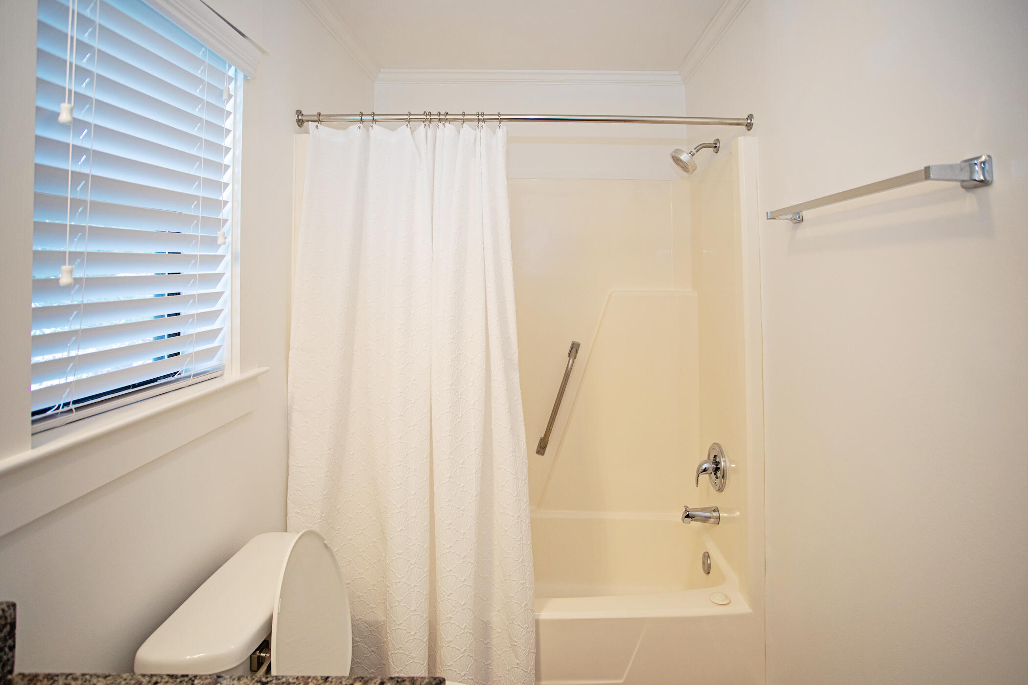 3799 East County Highway 30A, Unit H 2 Santa Rosa Beach, FL 32459 - Photo 23 of 41 a bathroom with a shower curtain and a window