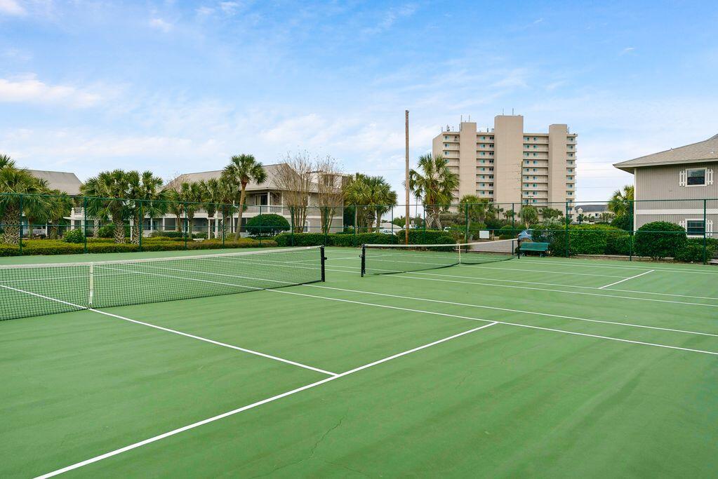 3799 East County Highway 30A, Unit H 2 Santa Rosa Beach, FL 32459 - Photo 30 of 41 a view of a tennis ground with large trees
