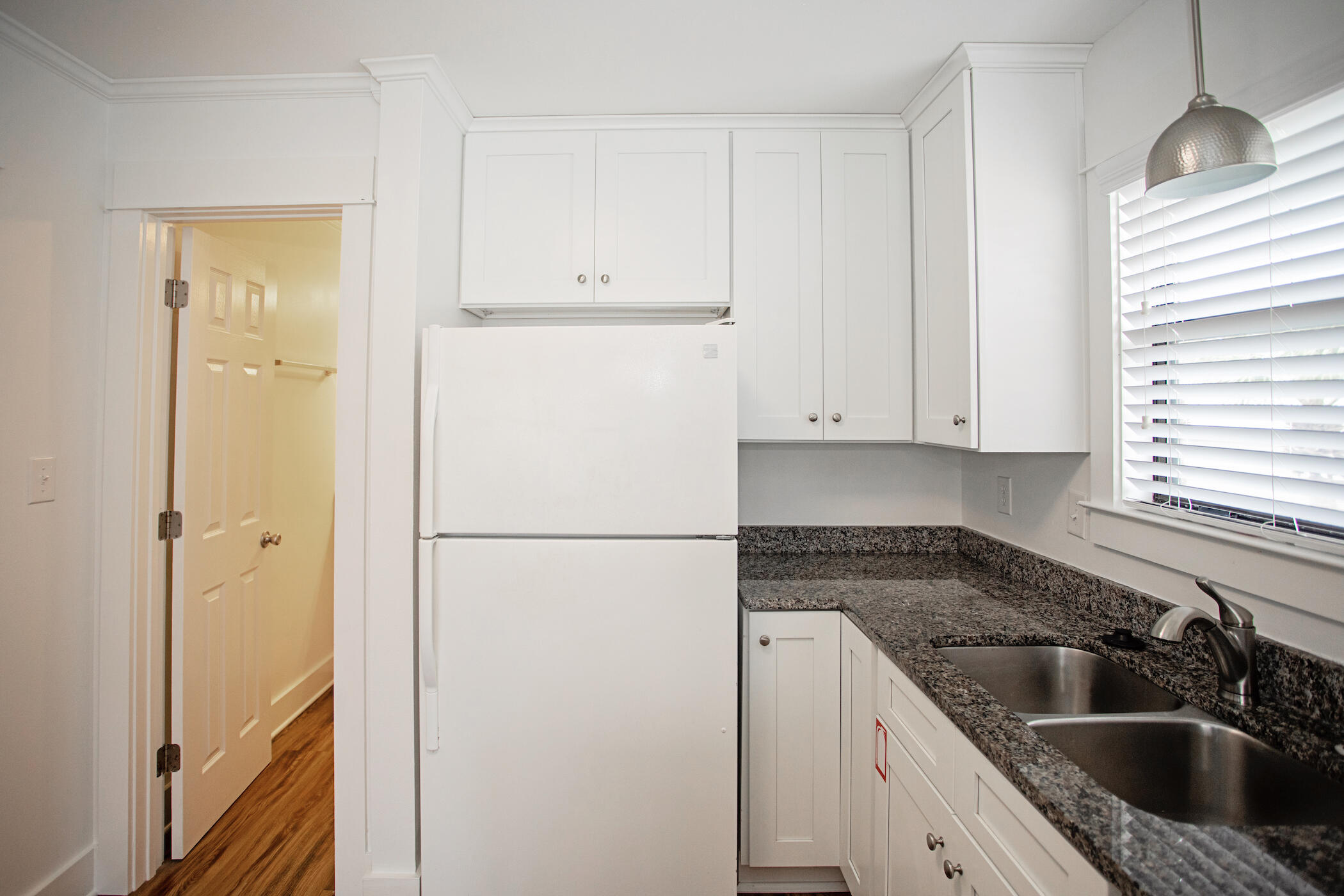 3799 East County Highway 30A, Unit H 2 Santa Rosa Beach, FL 32459 - Photo 10 of 41 a kitchen with a refrigerator sink and cabinets