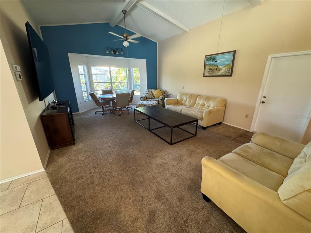 549 Warwick Lane Venice, FL 34293 - Photo 14 of 38 a living room with furniture and a flat screen tv