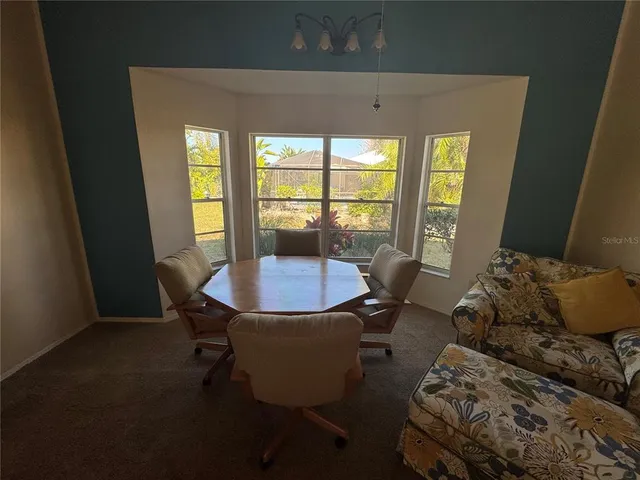 a living room with furniture and a table