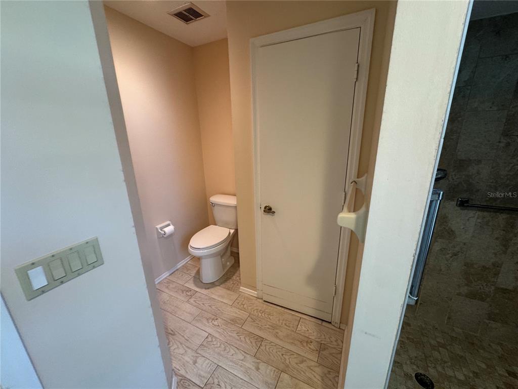 549 Warwick Lane Venice, FL 34293 - Photo 26 of 38 a bathroom with a toilet and a shower