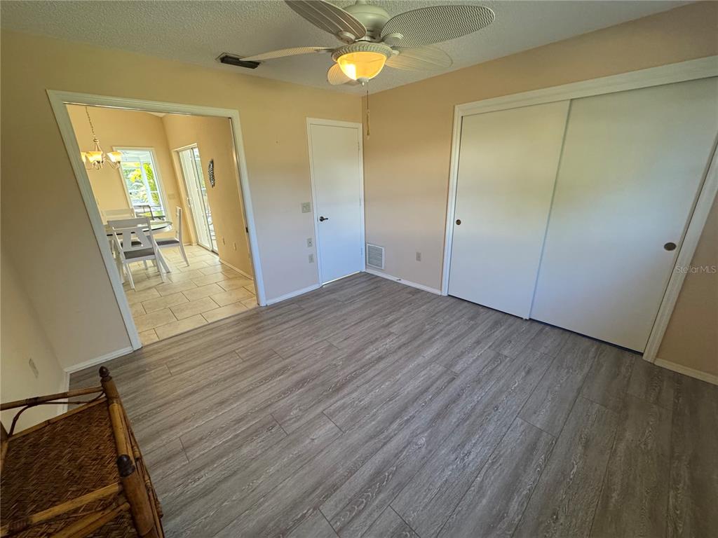 549 Warwick Lane Venice, FL 34293 - Photo 27 of 38 wooden floor in an empty room with a window
