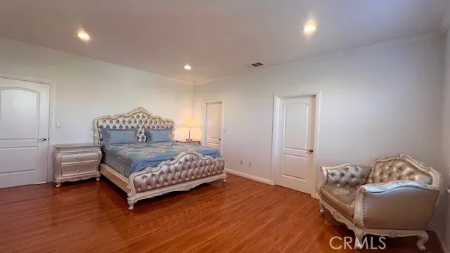 a bedroom with a bed and a chair