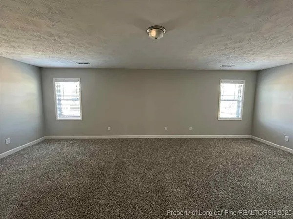 an empty room that has a window