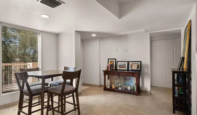 a view of a livingroom with furniture and a window