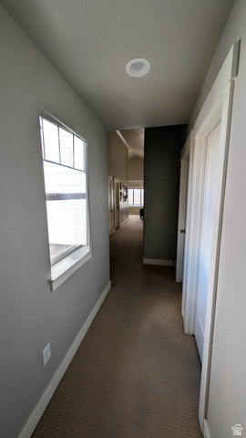 7689 Butterfield Road, Unit 274 Eagle Mountain, UT 84005 - Photo 11 of 25 Carpeted hallway with a window, recessed lighting, and white trim
