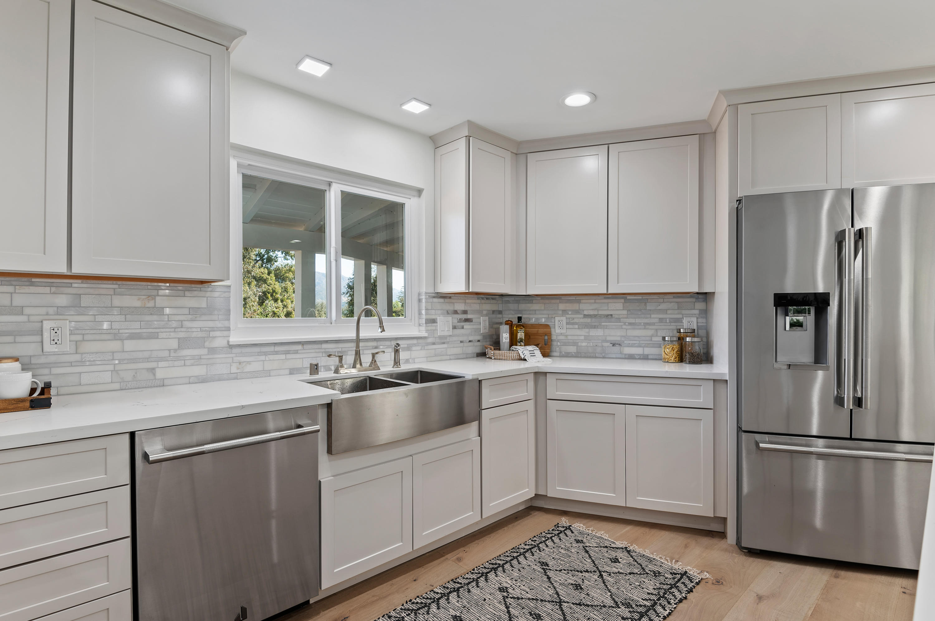 55 Crestview Lane Santa Barbara, CA 93108 - Photo 6 of 28 a kitchen with a sink appliances and cabinets
