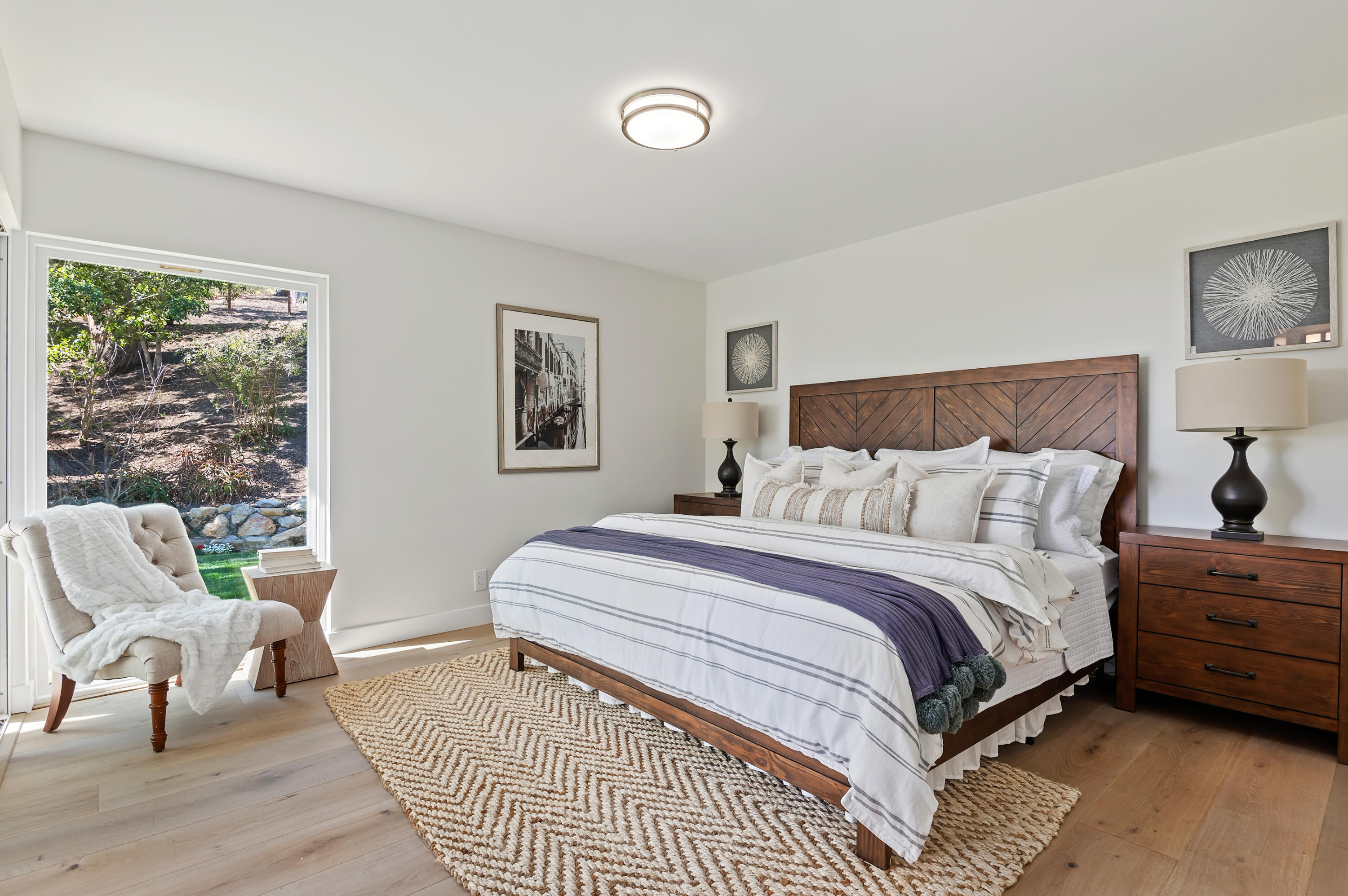 55 Crestview Lane Santa Barbara, CA 93108 - Photo 10 of 28 a spacious bedroom with a bed a couch and dresser