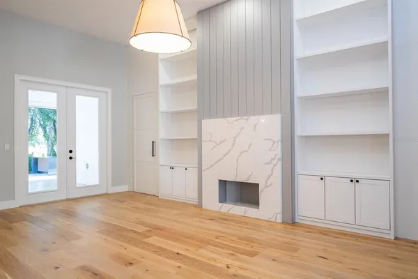 a kitchen with stainless steel appliances kitchen island granite countertop a refrigerator and a sink